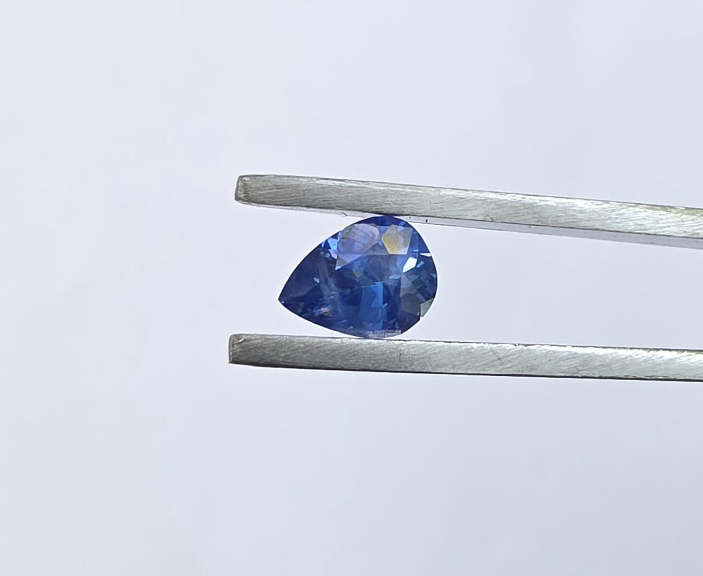 Natural Sri Lankan Blue Sapphire: Vivid Pear Shape, 0.75 Carat, Eye Clean